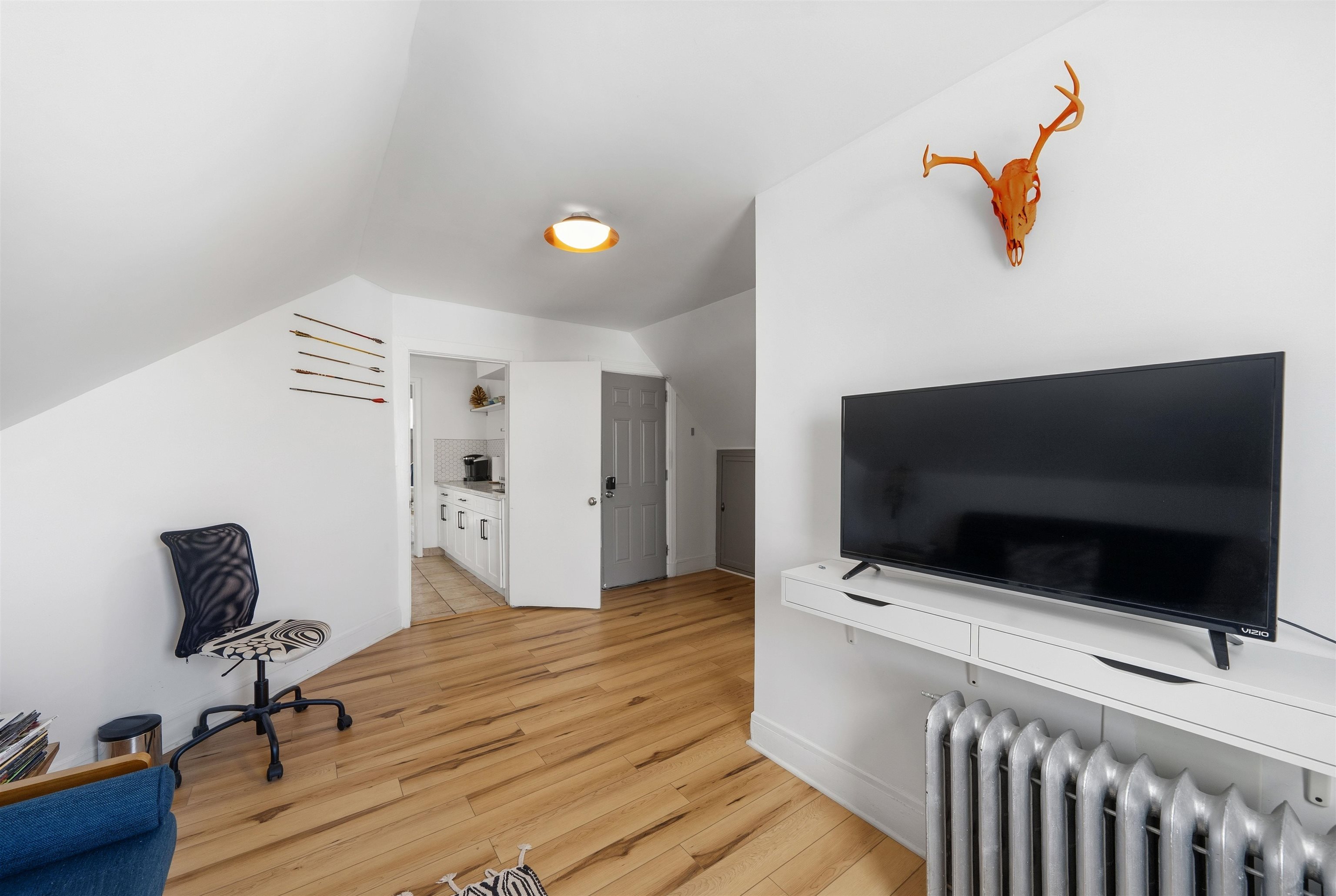124 73rd Street, Unit 3 North Bergen, NJ 07047 - Photo 3 of 14 a view of a livingroom with a flat screen tv