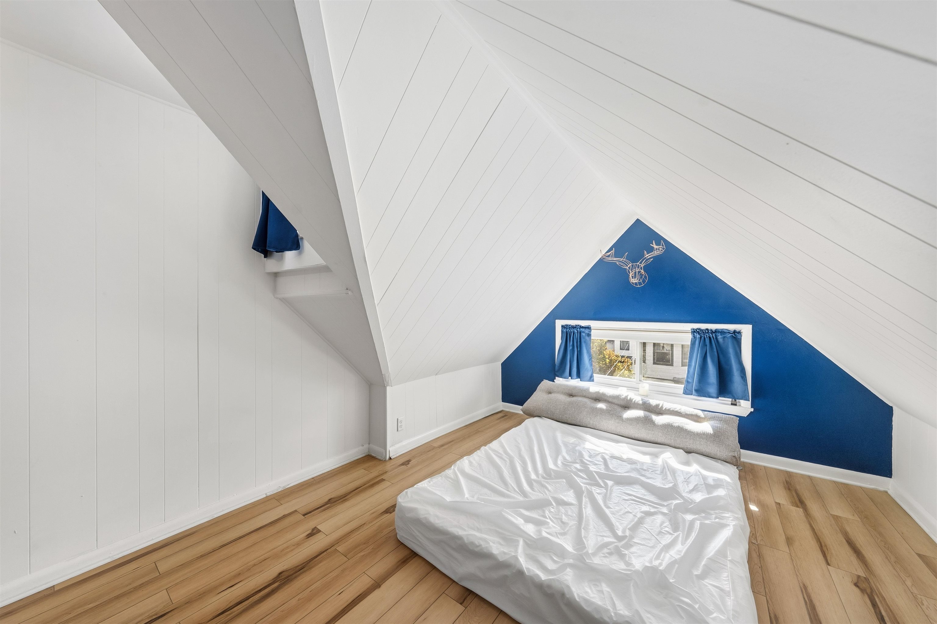 124 73rd Street, Unit 3 North Bergen, NJ 07047 - Photo 7 of 14 a view of a bedroom with wooden floor and hallway
