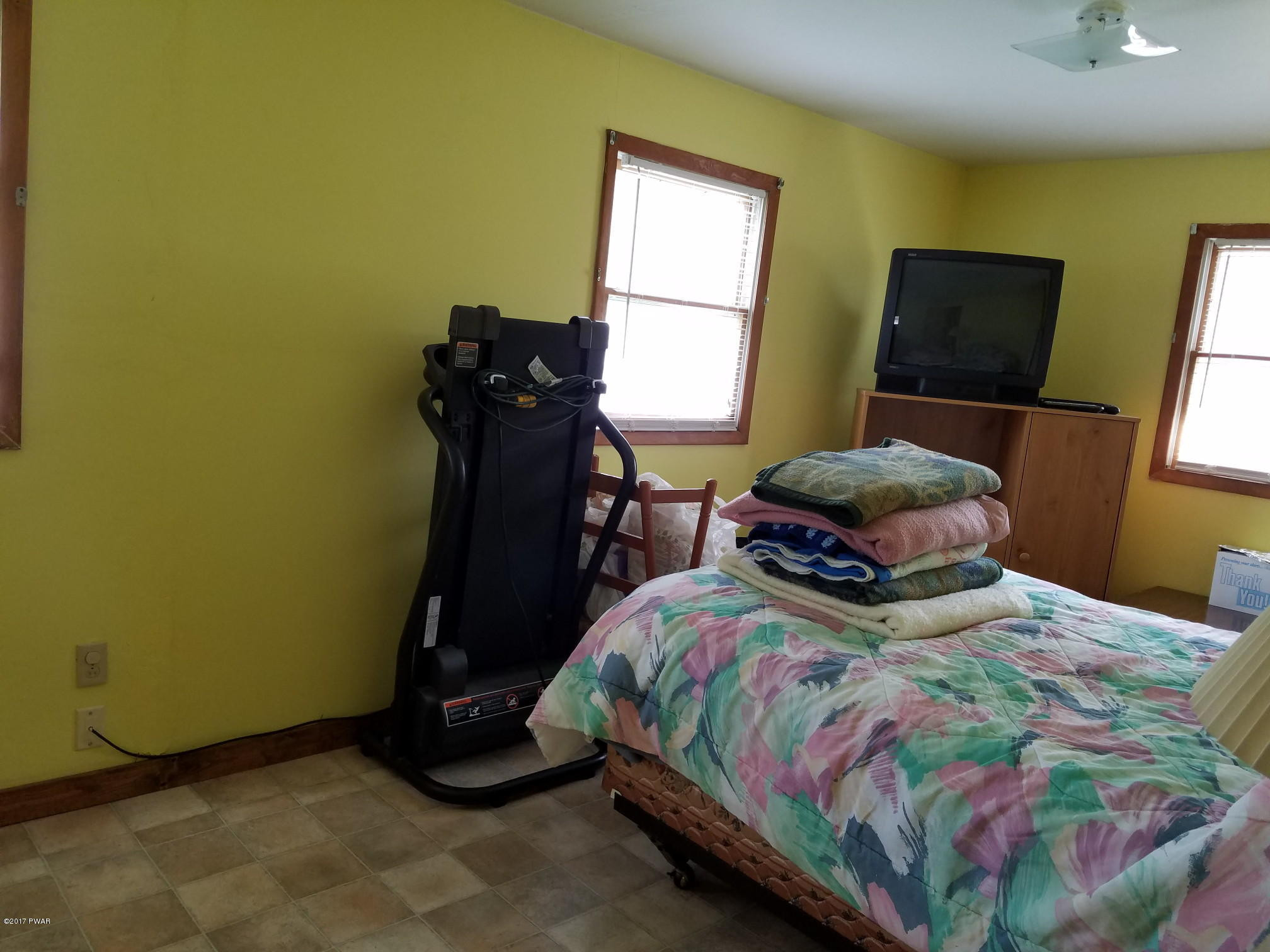 80 Fox Farm Road Windsor, NY 13865 - Photo 8 of 14 a bedroom with a bed a window and dresser