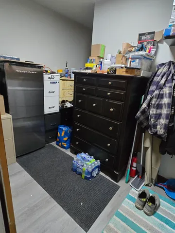 a bed room with a bed and a television