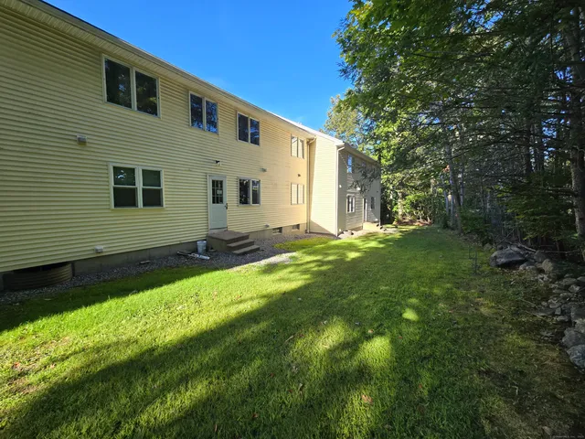 a backyard of a house with lots of green space