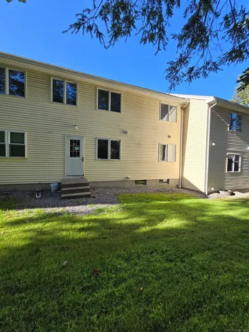 a backyard of a house with lots of green space