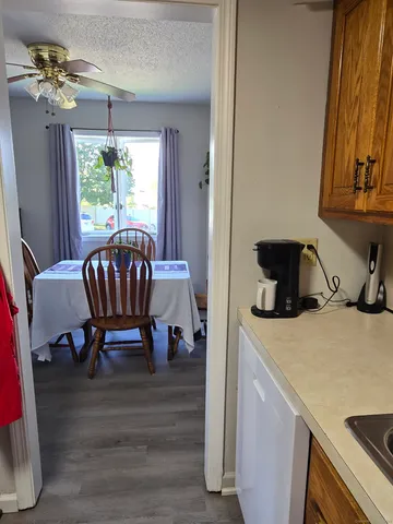 a view of a dining room with furniture window and outside view