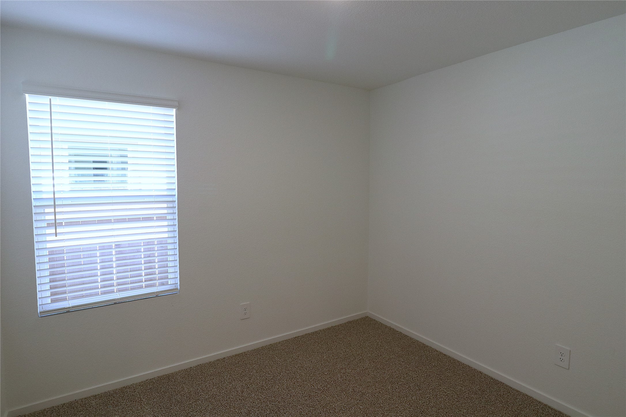 24134 Chirp Street Splendora, TX 77372 - Photo 11 of 14 an empty room with a window