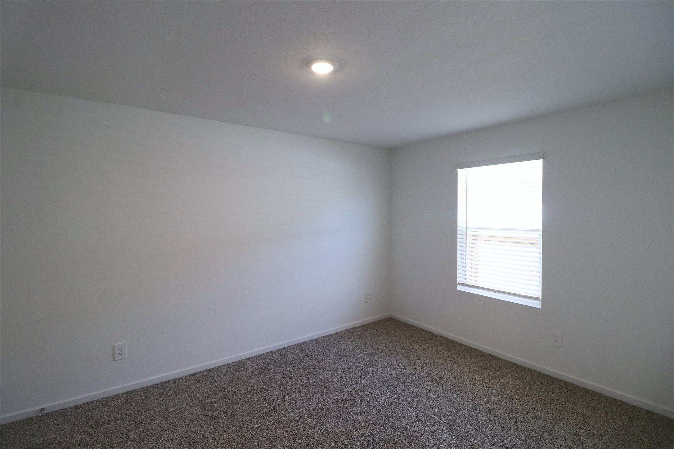 24134 Chirp Street Splendora, TX 77372 - Photo 13 of 14 an empty room with a window