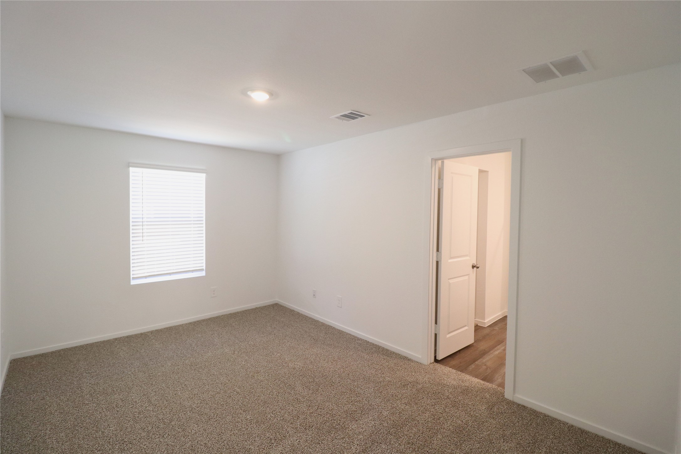 24134 Chirp Street Splendora, TX 77372 - Photo 3 of 14 a view of an empty room with a window