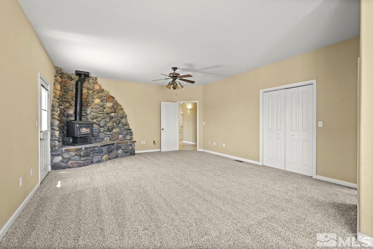 1683 Windmill Road Gardnerville, NV 89410 - Photo 30 of 40 a view of empty room with ceiling fan and window