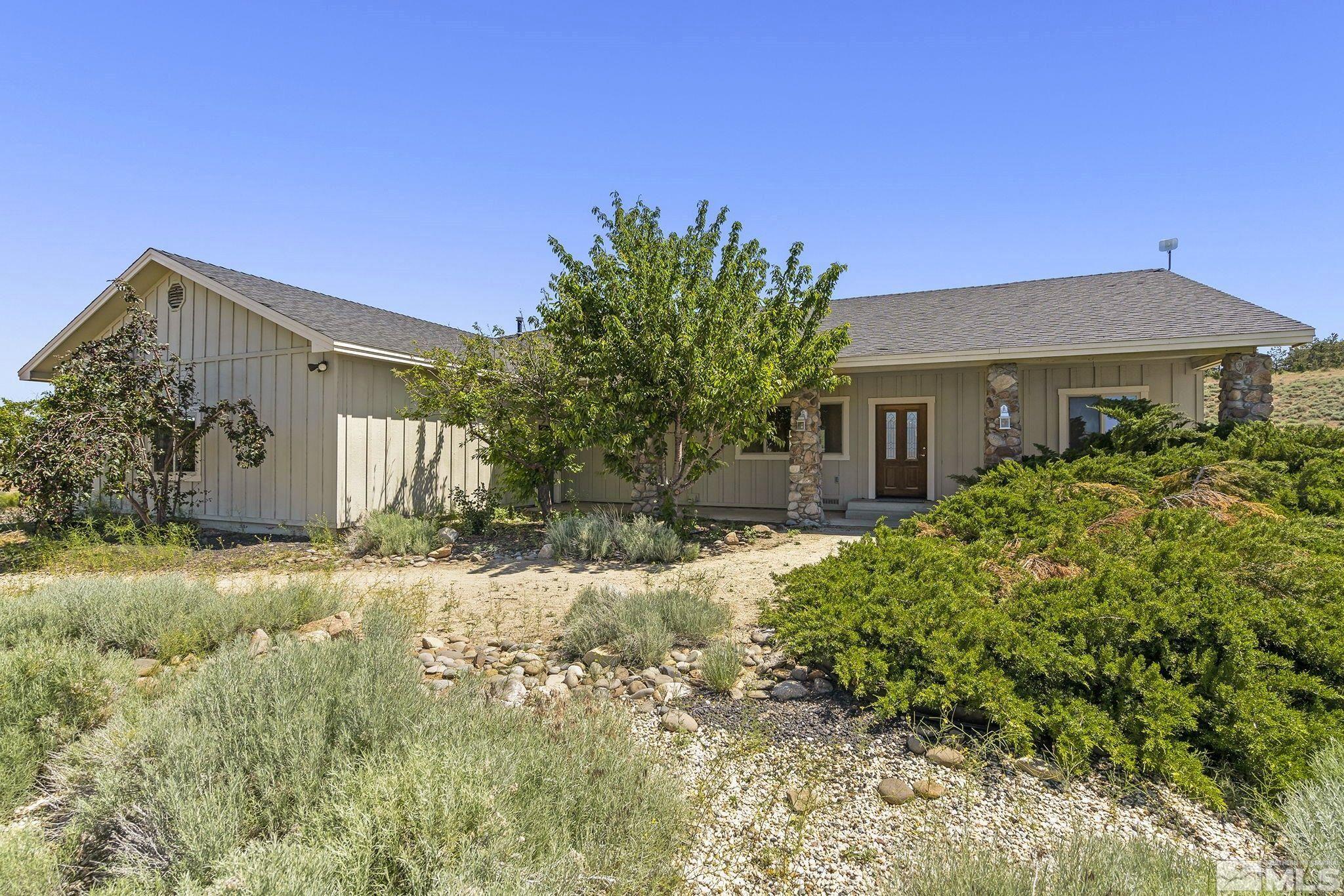 1683 Windmill Road Gardnerville, NV 89410 - Photo 3 of 40 a front view of a house with a yard