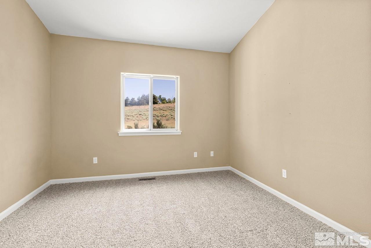 1683 Windmill Road Gardnerville, NV 89410 - Photo 31 of 40 an empty room with a window