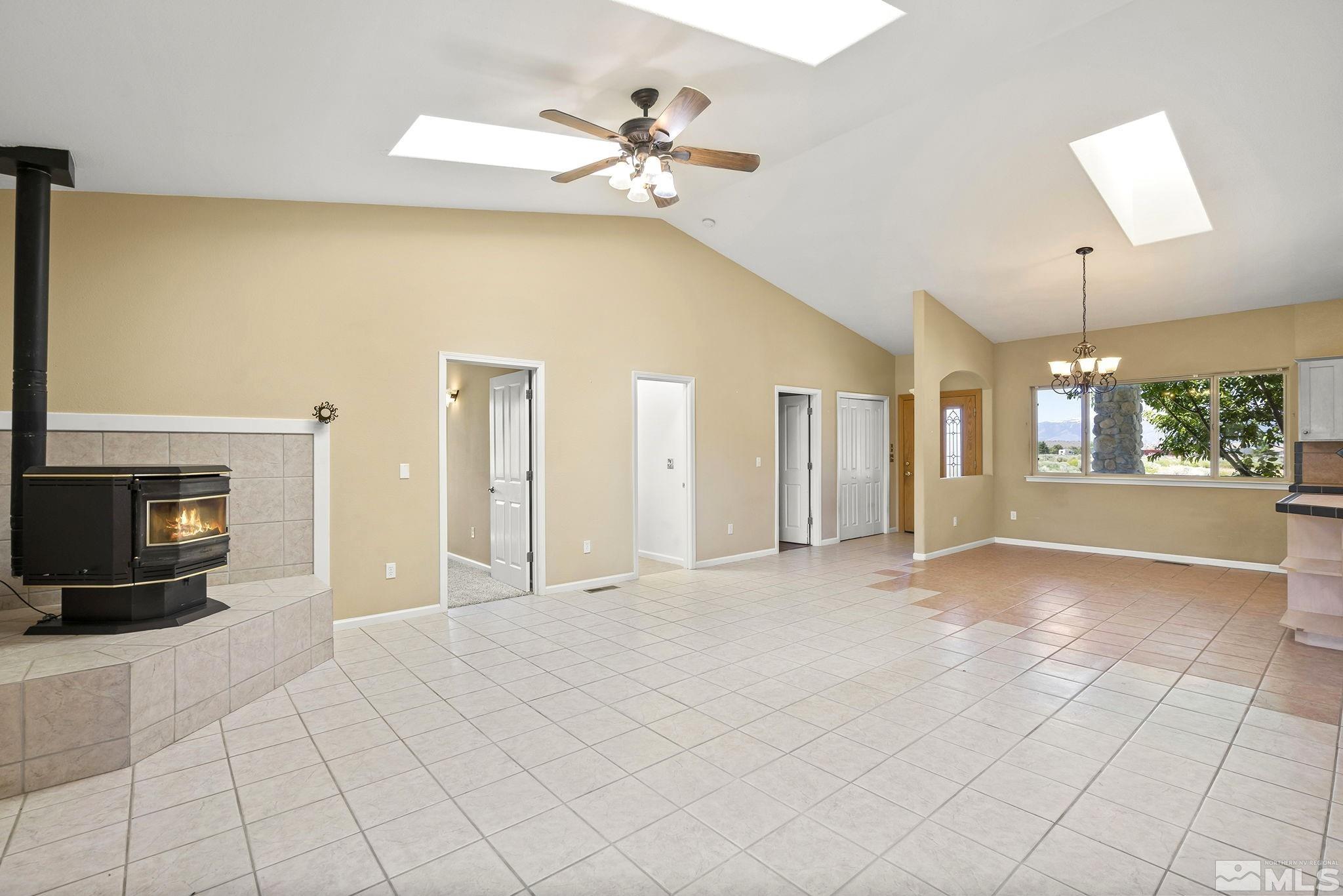 1683 Windmill Road Gardnerville, NV 89410 - Photo 36 of 40 an empty room with windows and fireplace