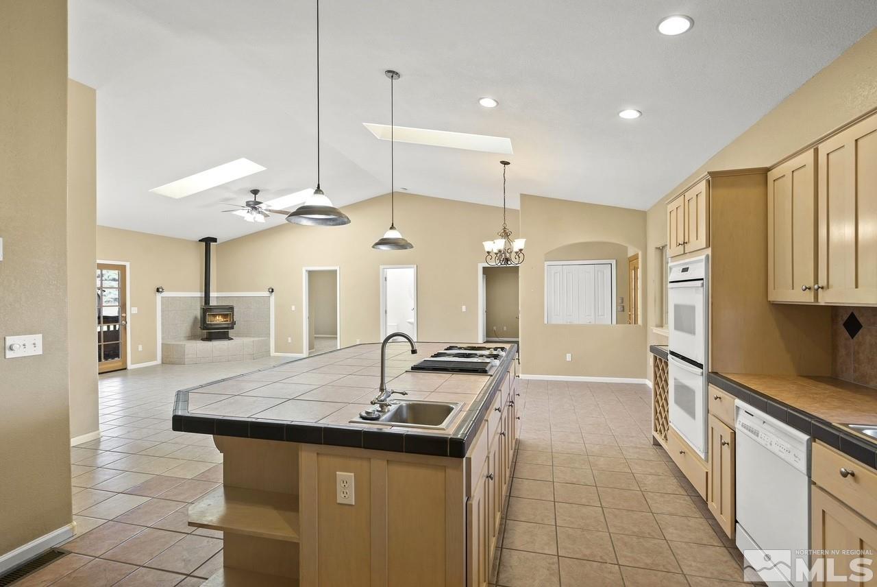 1683 Windmill Road Gardnerville, NV 89410 - Photo 40 of 40 a kitchen with stainless steel appliances granite countertop a sink and a refrigerator