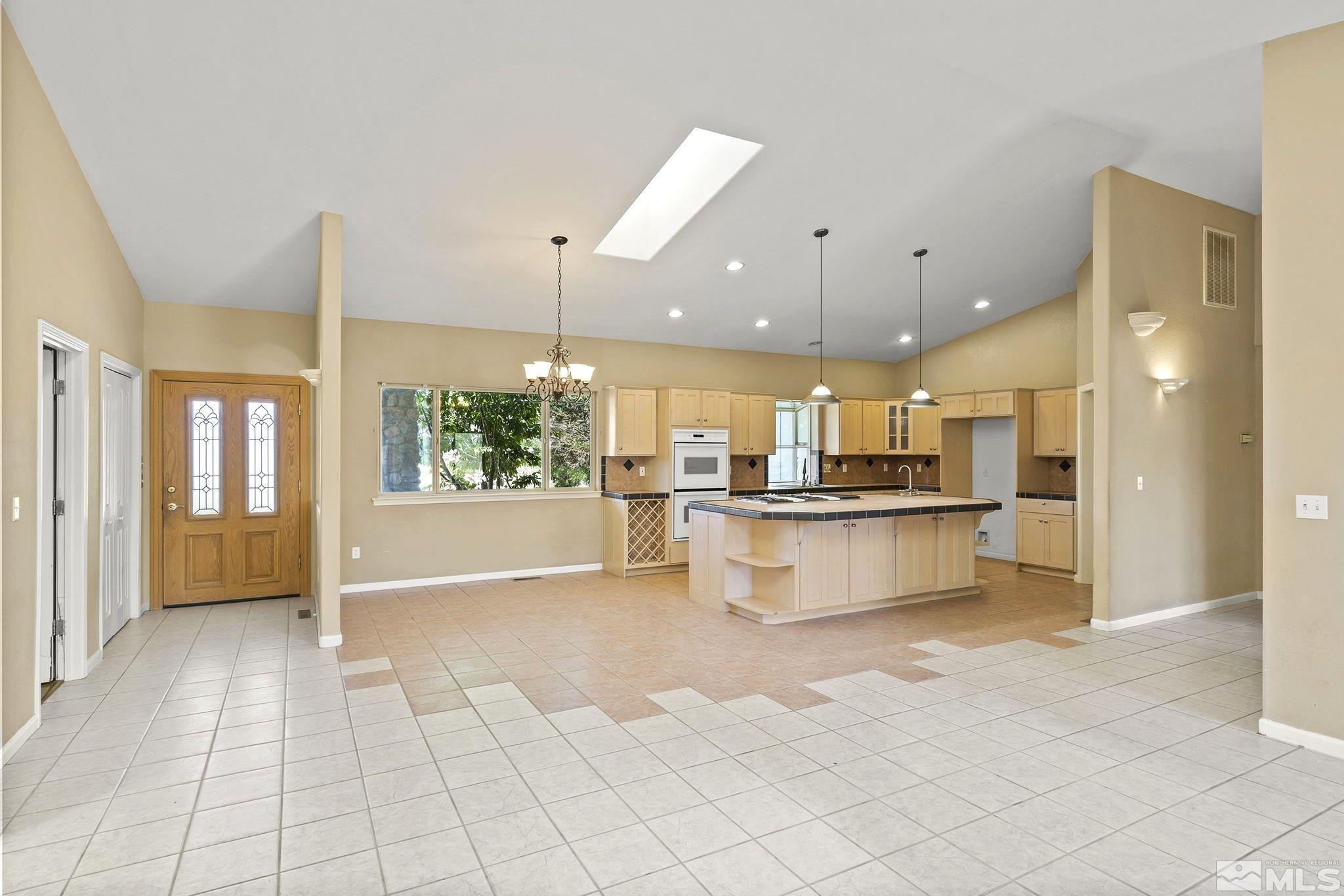 1683 Windmill Road Gardnerville, NV 89410 - Photo 5 of 40 a view of kitchen with counter top and refrigerator