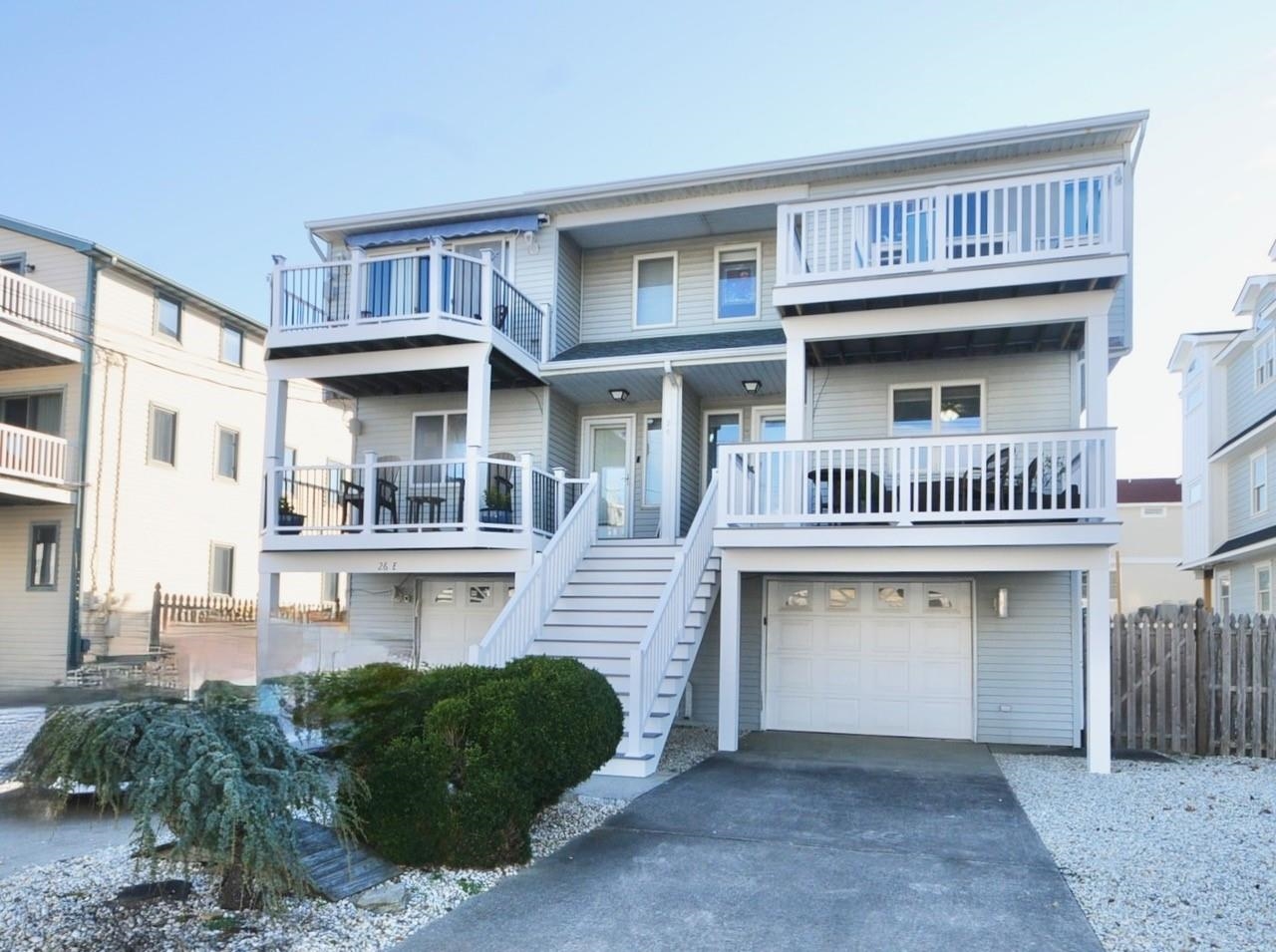26 73rd Street, Unit WEST Sea Isle City, NJ 08243 - Photo 9 of 21 a front view of a house with entryway