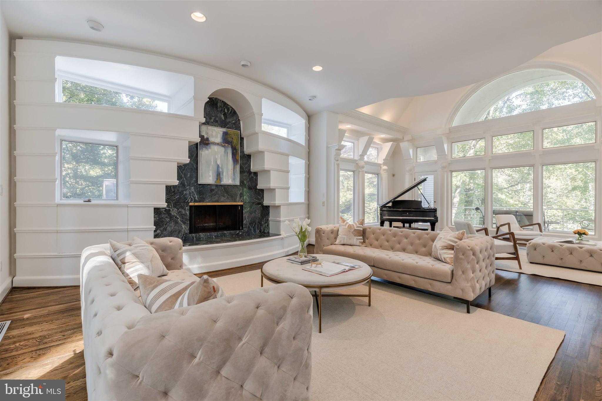 1371 Kirby Road McLean, VA 22101 - Photo 8 of 36 a living room with furniture a fireplace and a large window