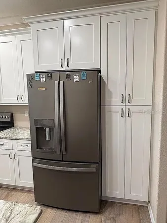 a view of cabinets with wooden floor