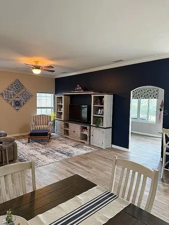 a living room with furniture fireplace and flat screen tv