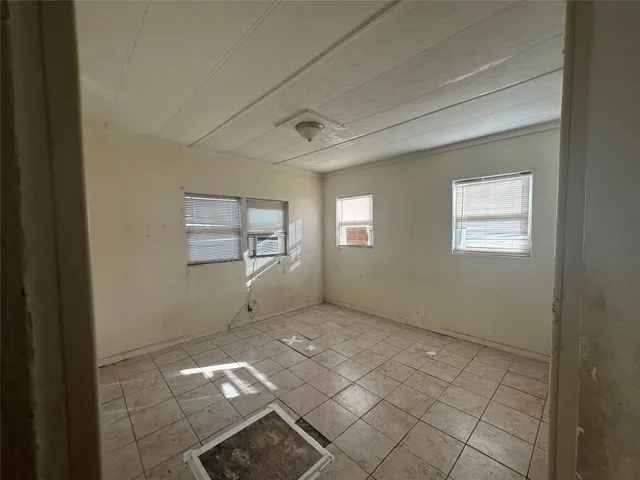 an empty room with windows