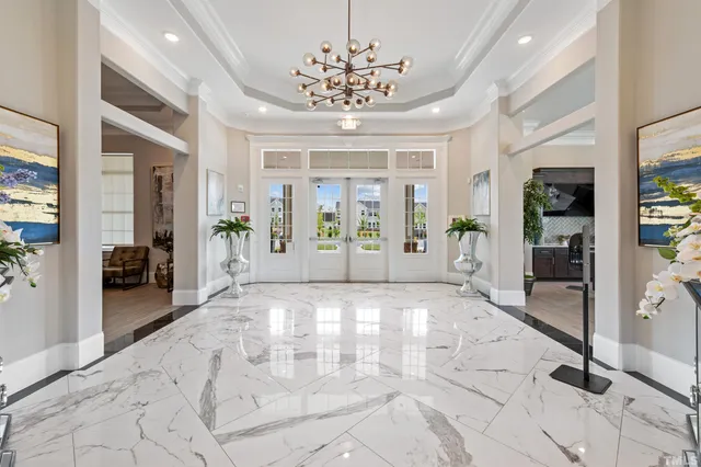 a view of an entryway with a chandelier