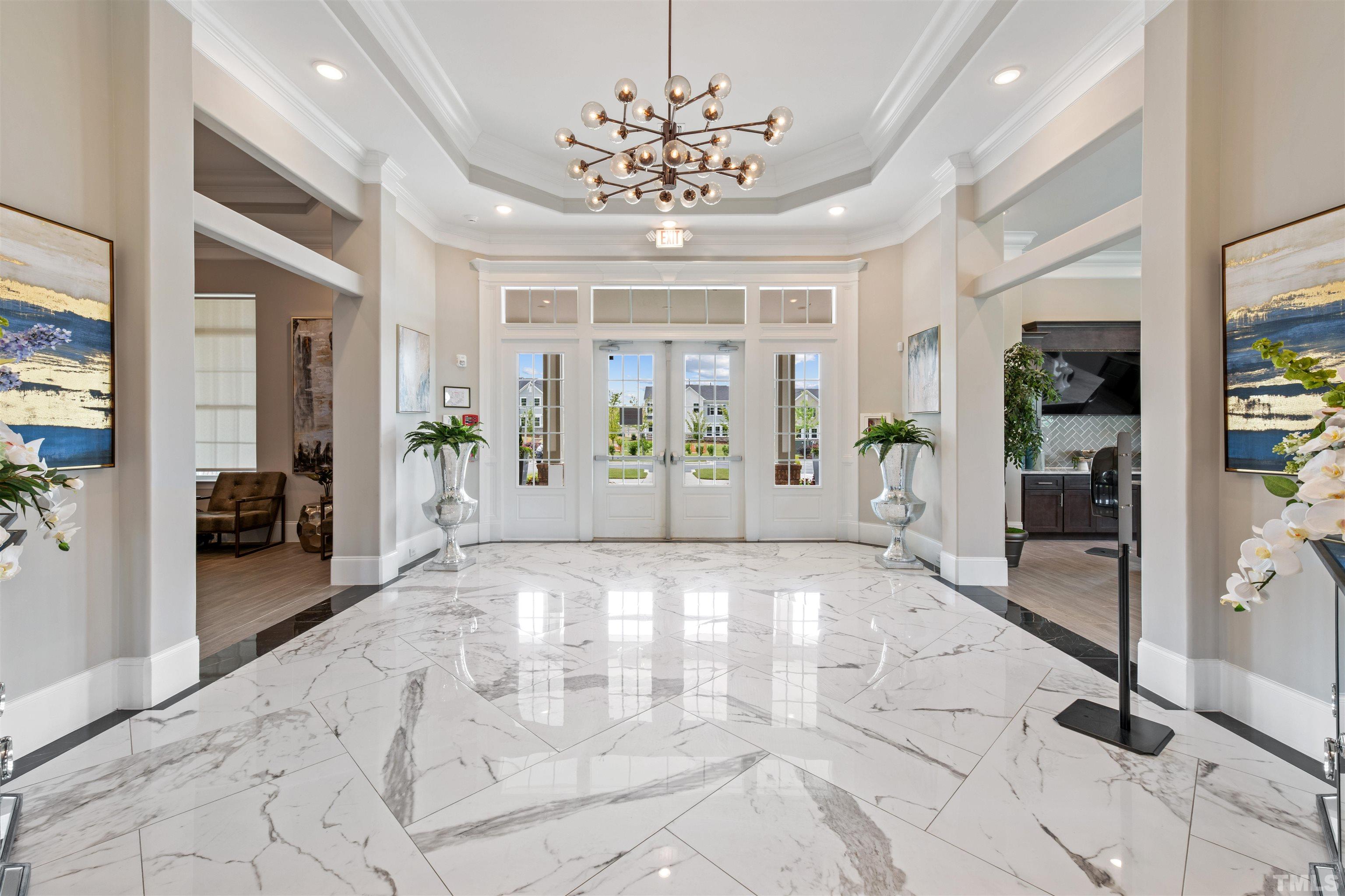 2269 Abbeyhill Drive Raleigh, NC 27610 - Photo 5 of 13 a view of an entryway with a chandelier