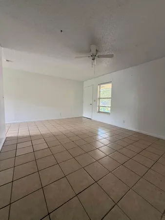 a view of an empty room and window