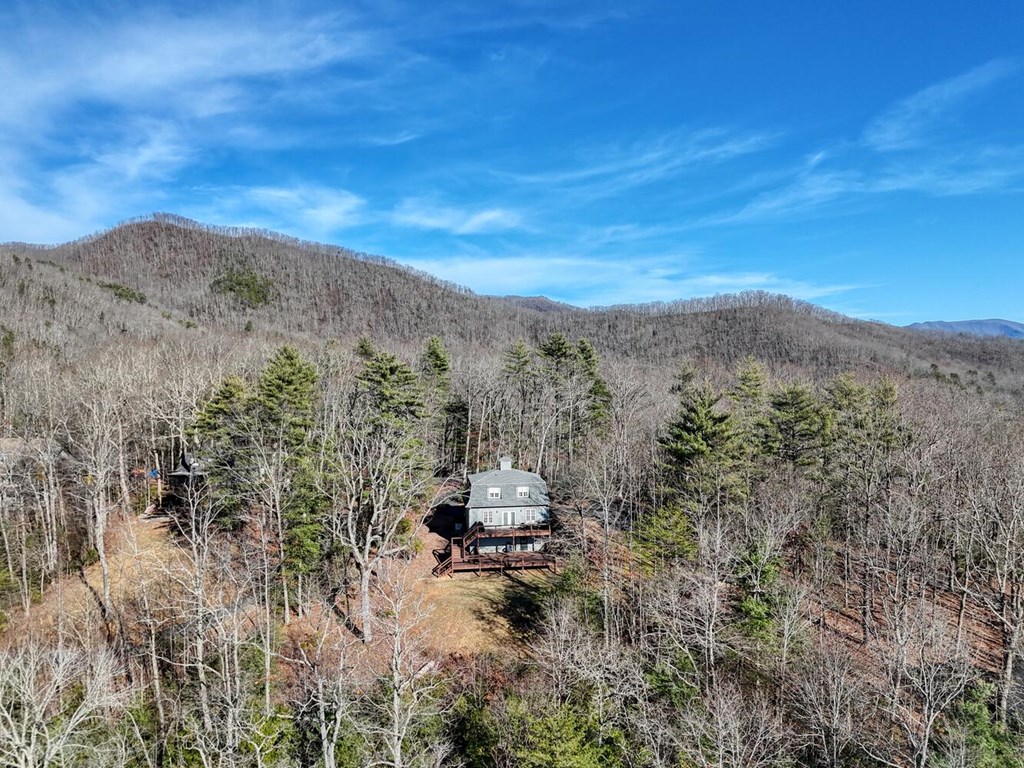 417 Hidden Forest Lane Hayesville, NC 28904 - Photo 25 of 26 a view of a mountain in the distance in a field
