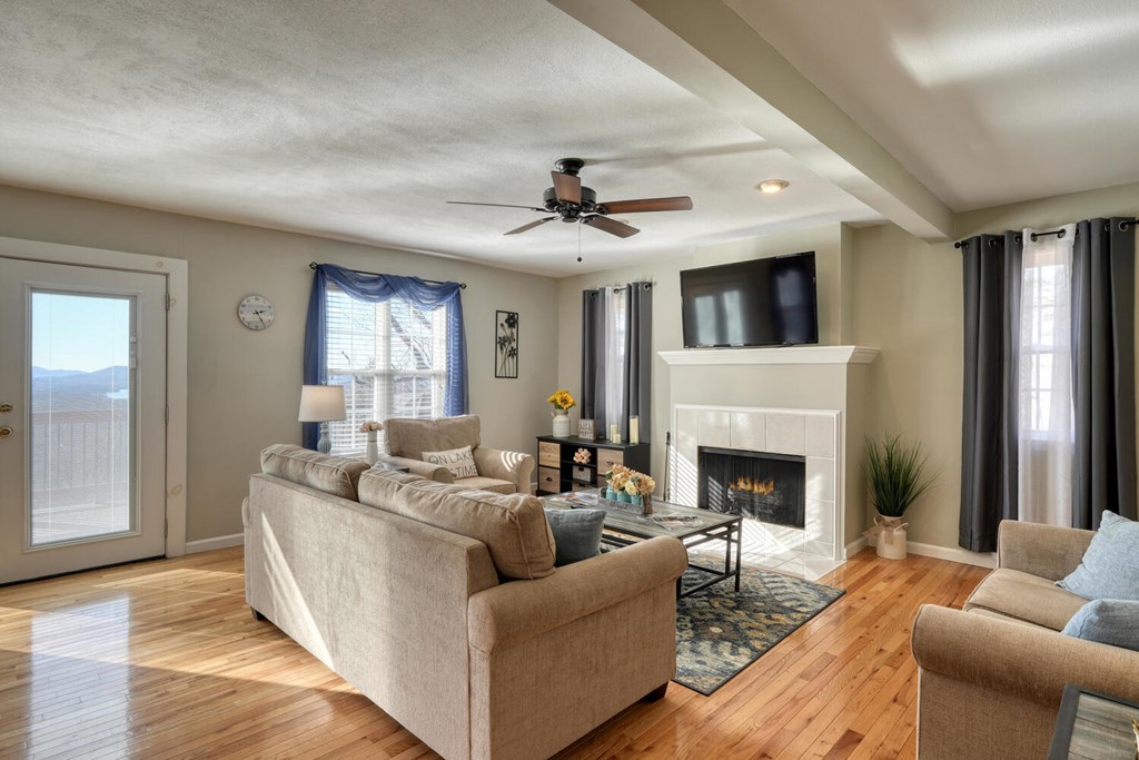 417 Hidden Forest Lane Hayesville, NC 28904 - Photo 3 of 26 a living room with furniture and a fireplace