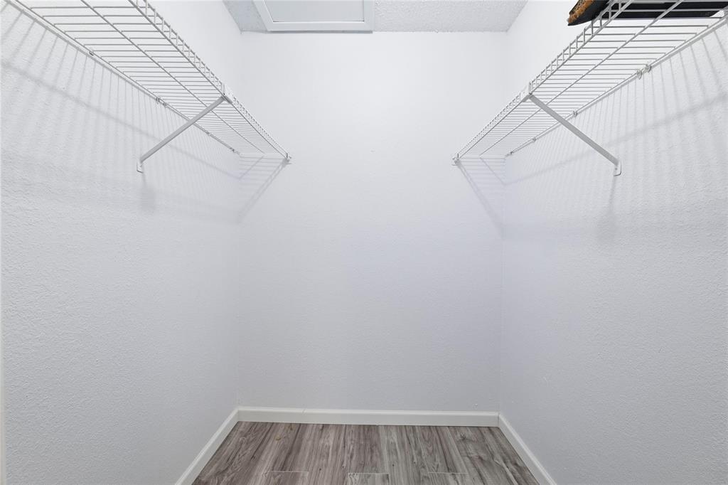 12482 Abrams Road, Unit 1327 Dallas, TX 75243 - Photo 13 of 32 a view of a room with racks on the wall