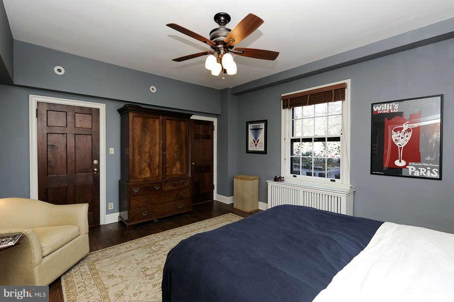 3000 Tilden Street Northwest, Unit 102 Washington, DC 20008 - Photo 15 of 29 a bedroom with a bed and a large window