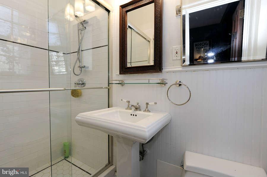 3000 Tilden Street Northwest, Unit 102 Washington, DC 20008 - Photo 17 of 29 a bathroom with a sink and a mirror