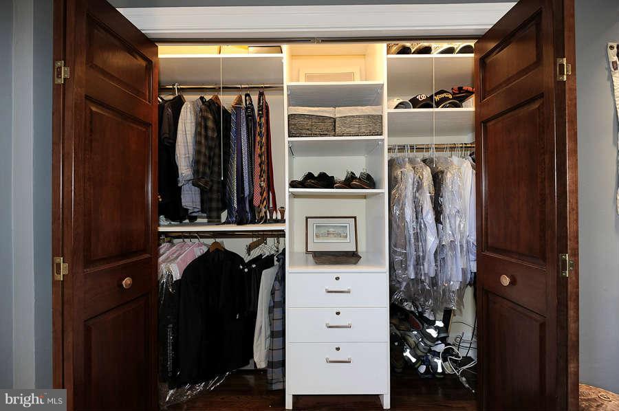 3000 Tilden Street Northwest, Unit 102 Washington, DC 20008 - Photo 18 of 29 a view of walk in closet with clothes and shoes