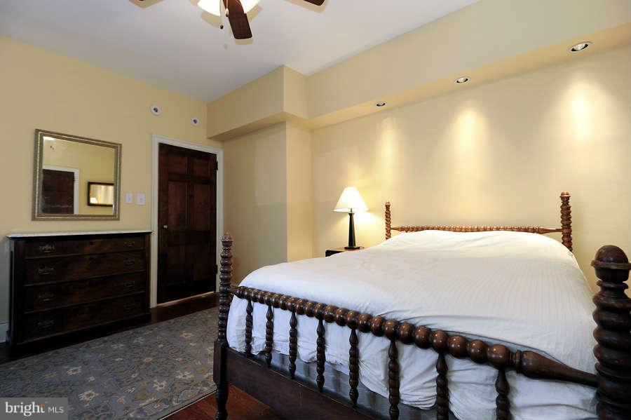 3000 Tilden Street Northwest, Unit 102 Washington, DC 20008 - Photo 20 of 29 a bedroom with a bed and a dresser