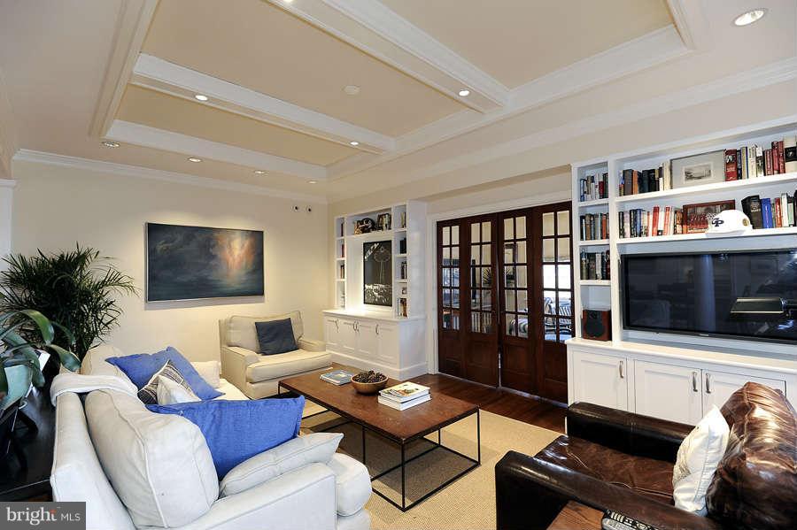 3000 Tilden Street Northwest, Unit 102 Washington, DC 20008 - Photo 3 of 29 a living room with furniture and a flat screen tv