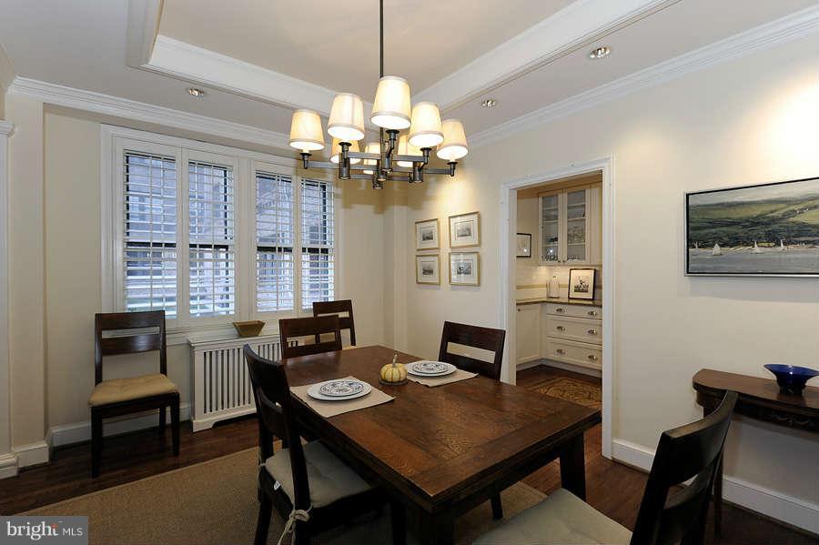 3000 Tilden Street Northwest, Unit 102 Washington, DC 20008 - Photo 6 of 29 a view of a dining room with furniture window and wooden floor