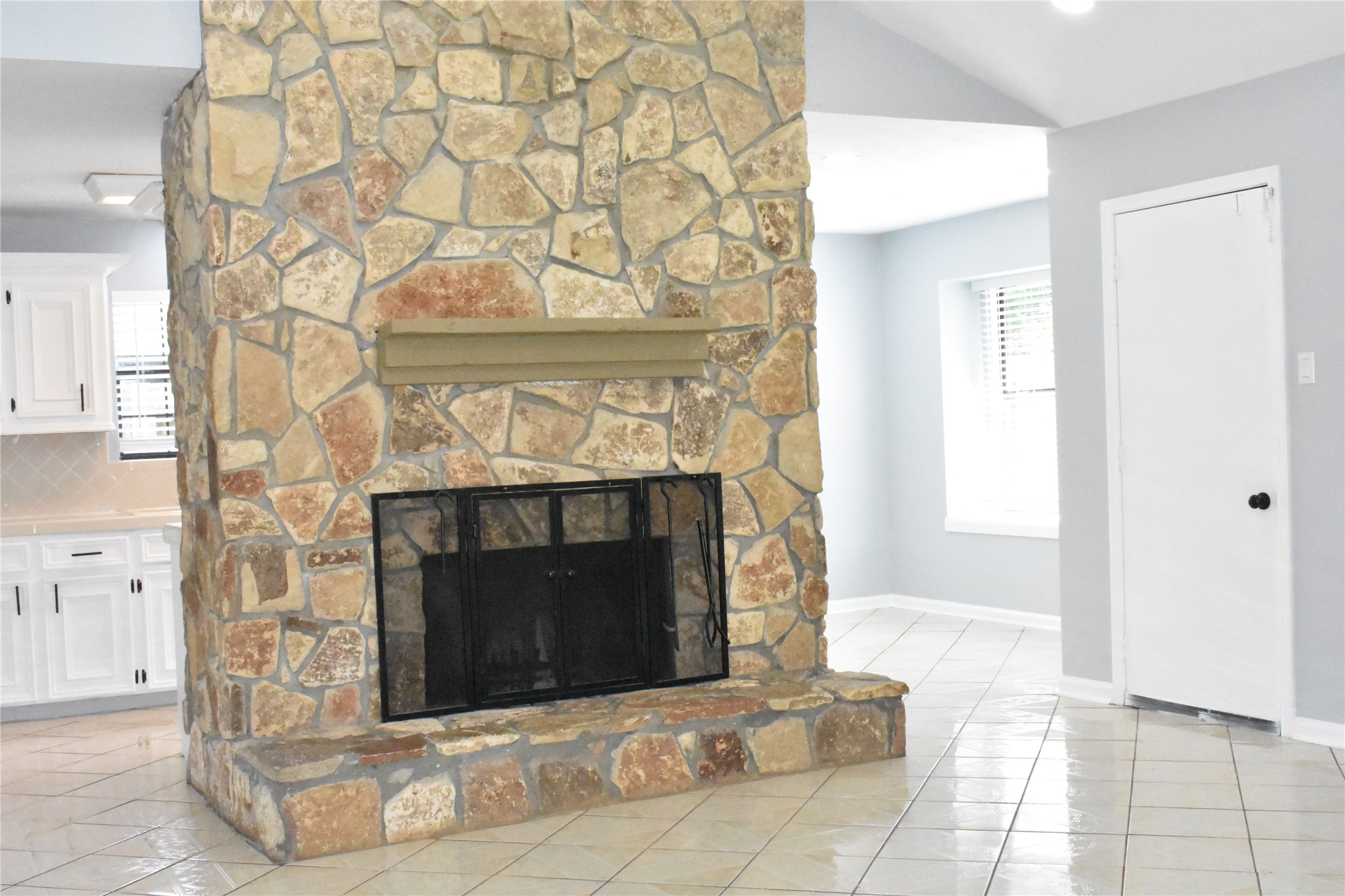 1347 Somercotes Lane Channelview, TX 77530 - Photo 5 of 30 a living room with a fireplace and a table