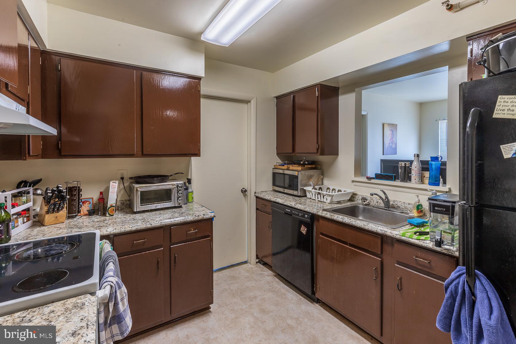 4801 Berwyn House Road, Unit A4801 College Park, MD 20740 - Photo 7 of 17 Kitchen with Pass Through to Living Room