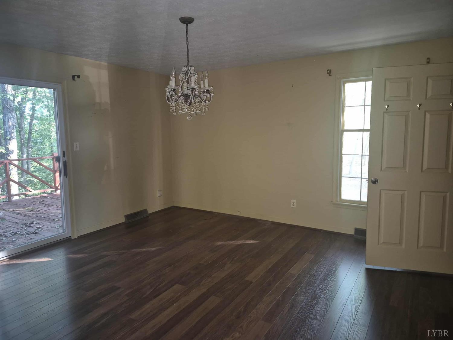 404 Darrell Lane Hurt, VA 24563 - Photo 12 of 31 an empty room with wooden floor and windows