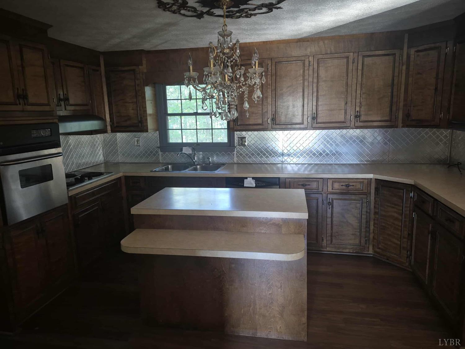404 Darrell Lane Hurt, VA 24563 - Photo 30 of 31 a kitchen with a sink and cabinets