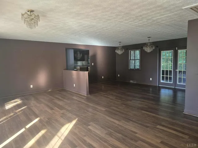 a view of a livingroom with wooden floor