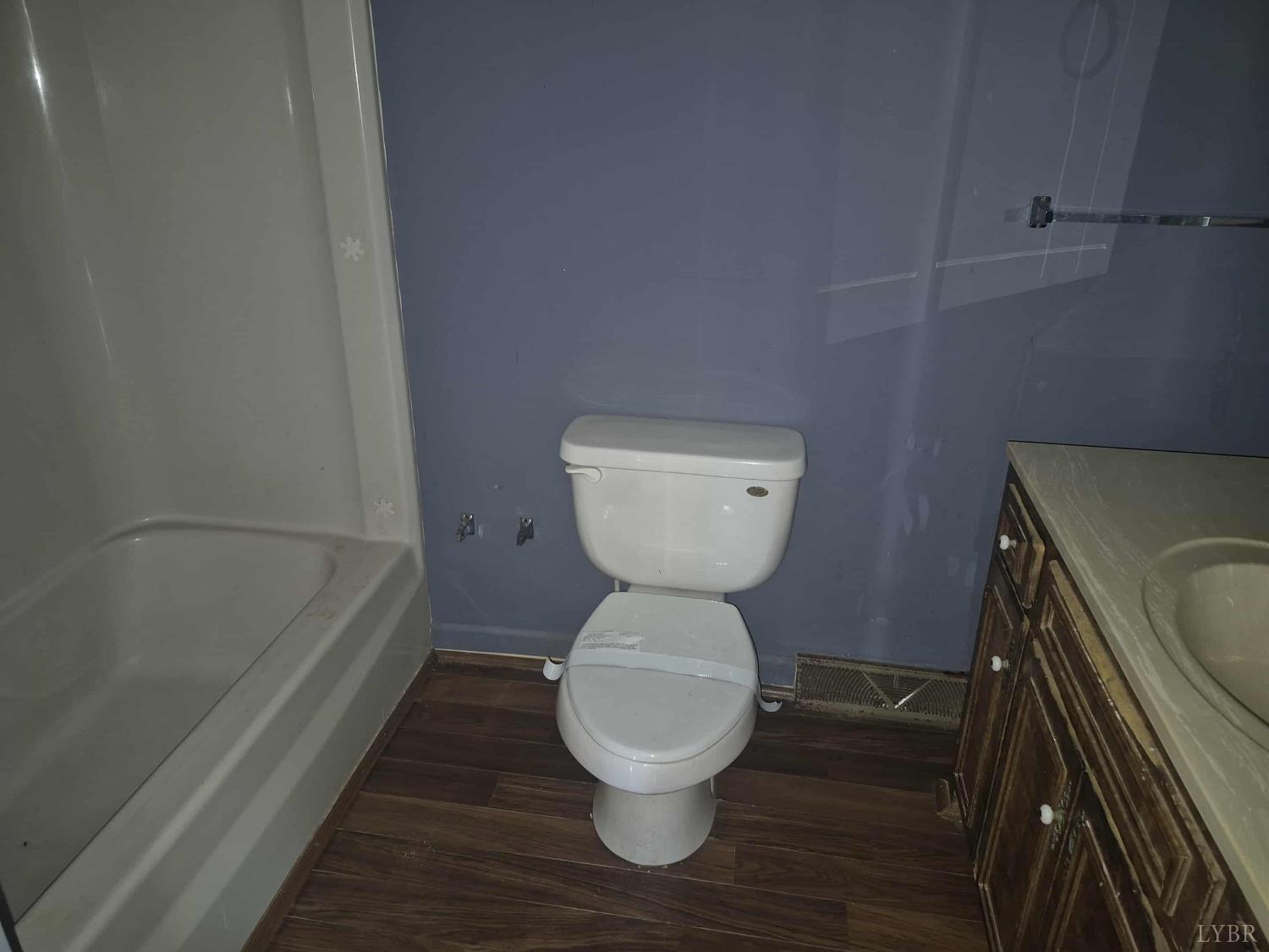404 Darrell Lane Hurt, VA 24563 - Photo 9 of 31 a bathroom with a toilet and a bathtub