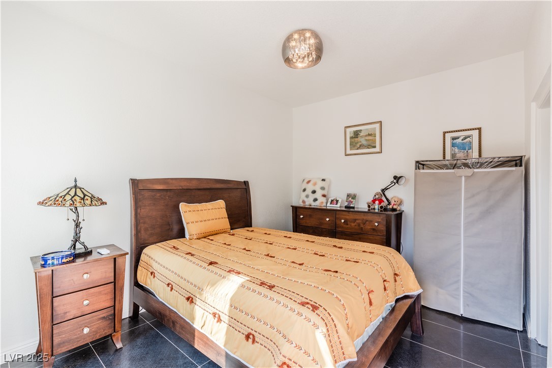 2339 Prometheus Court Henderson, NV 89074 - Photo 11 of 92 Bedroom featuring dark tile patterned floors
