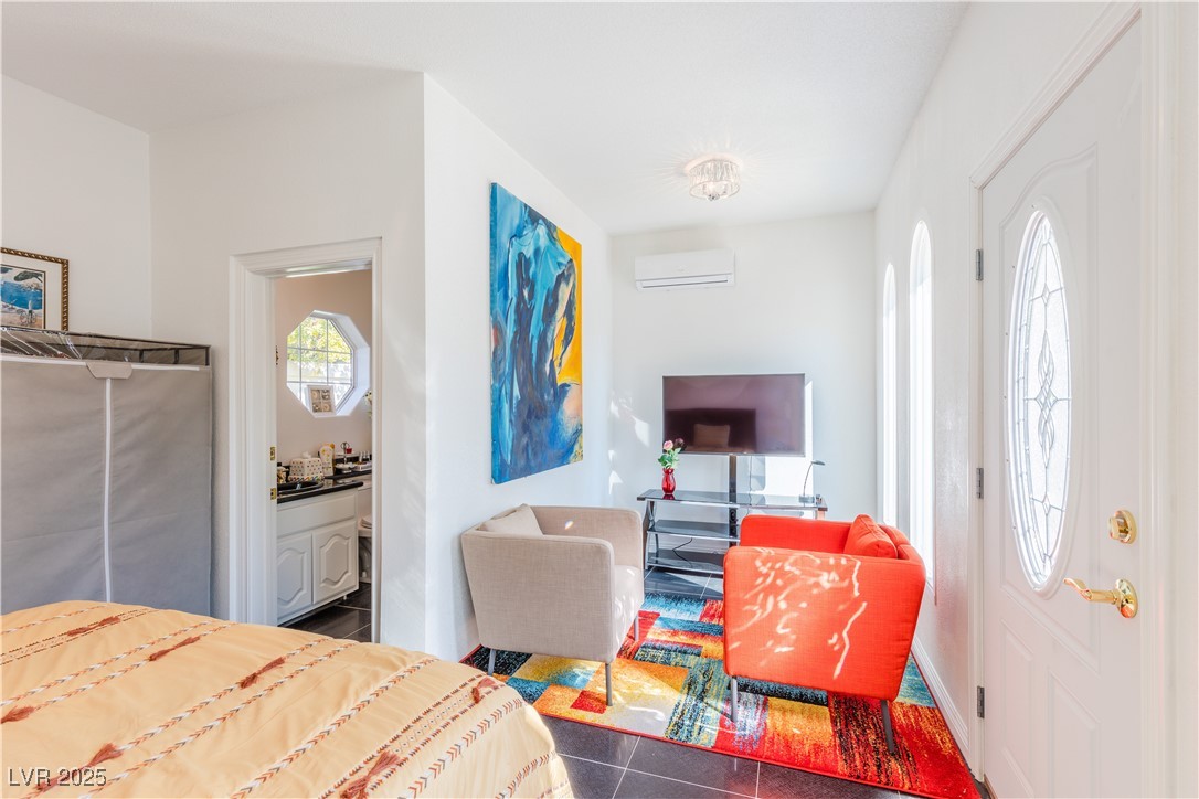 2339 Prometheus Court Henderson, NV 89074 - Photo 12 of 92 Bedroom with ensuite bathroom and a wall mounted A