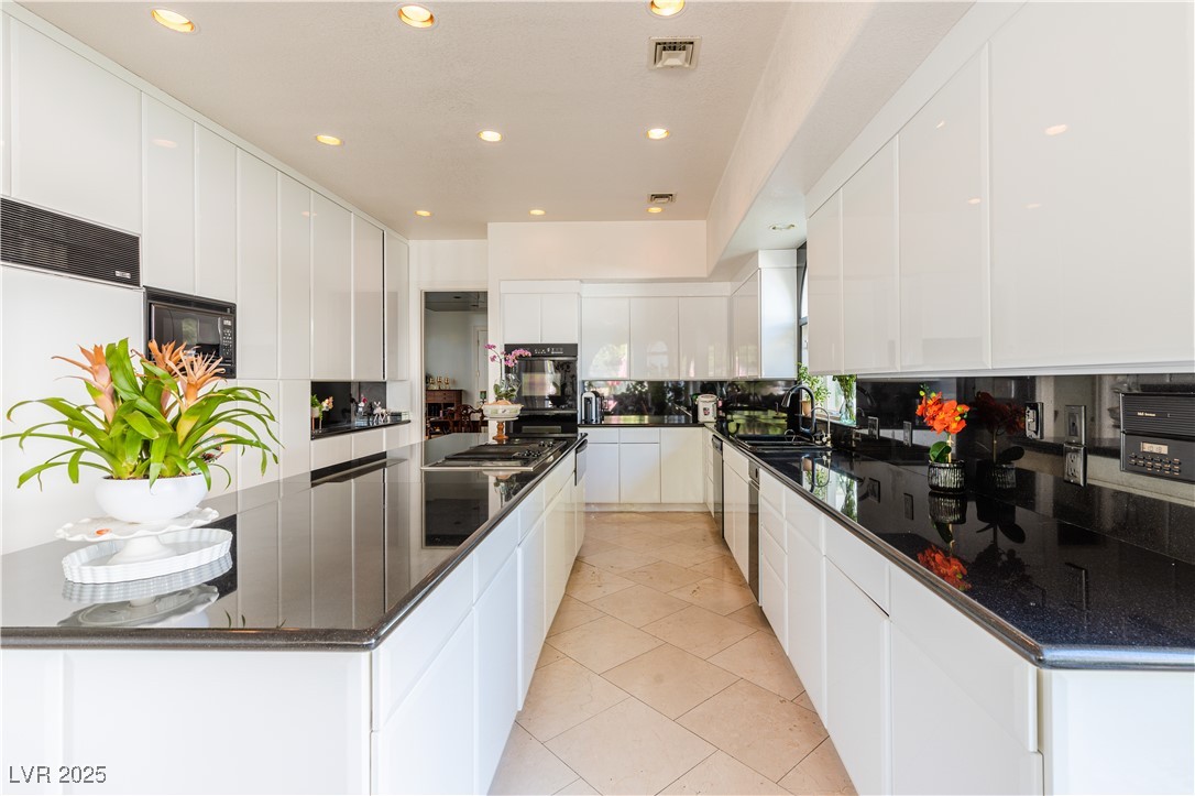 2339 Prometheus Court Henderson, NV 89074 - Photo 31 of 92 Kitchen featuring a spacious island, modern cabine