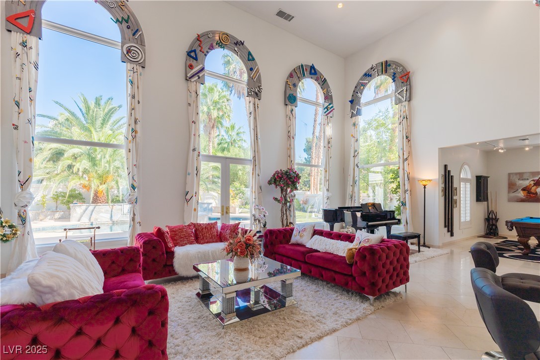 2339 Prometheus Court Henderson, NV 89074 - Photo 51 of 92 Tiled living room featuring visible vents and a hi