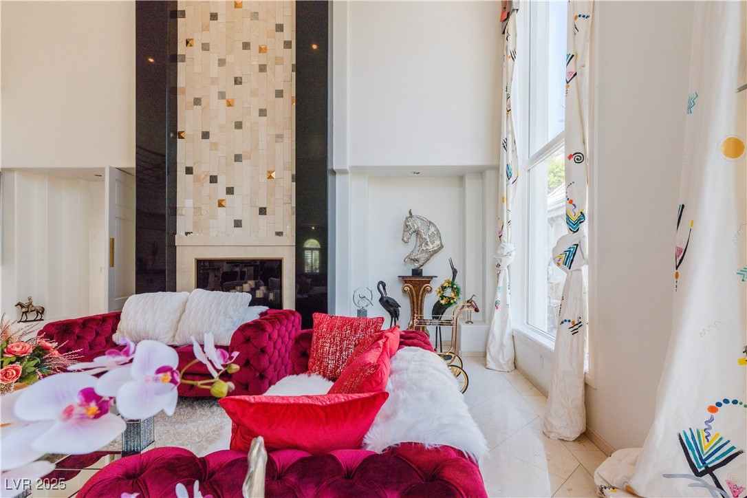 2339 Prometheus Court Henderson, NV 89074 - Photo 52 of 92 Living area with a towering ceiling, light tile pa