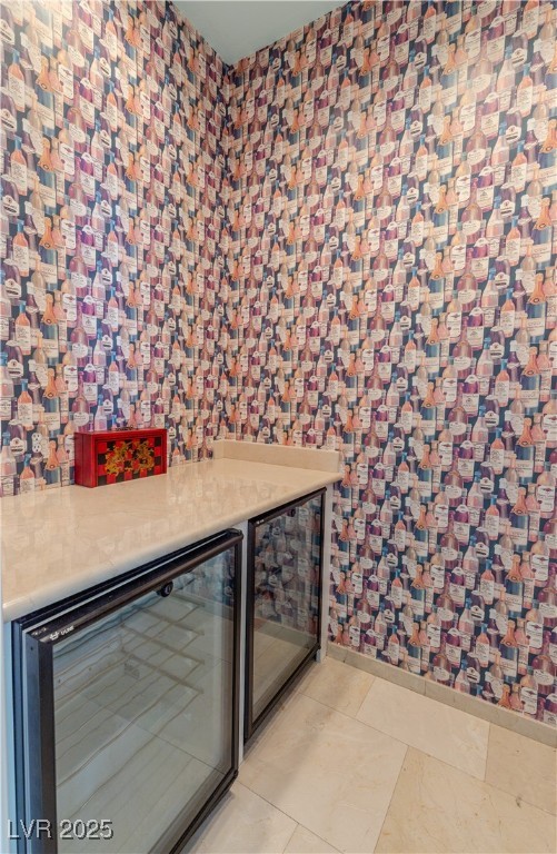 2339 Prometheus Court Henderson, NV 89074 - Photo 55 of 92 Bar with beverage cooler, a bar, and light tile pa
