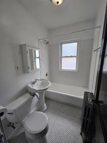 a bathroom with a sink toilet and a bathtub