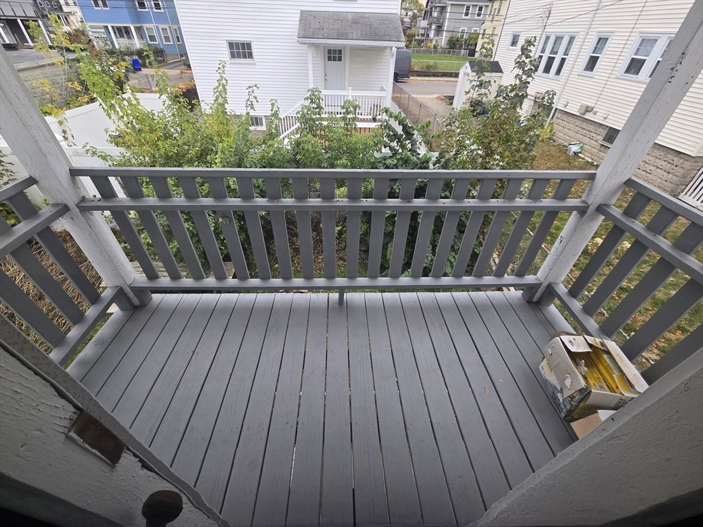 70 Montcalm Avenue, Unit 2 Boston, MA 02135 - Photo 8 of 8 a balcony with wooden floor