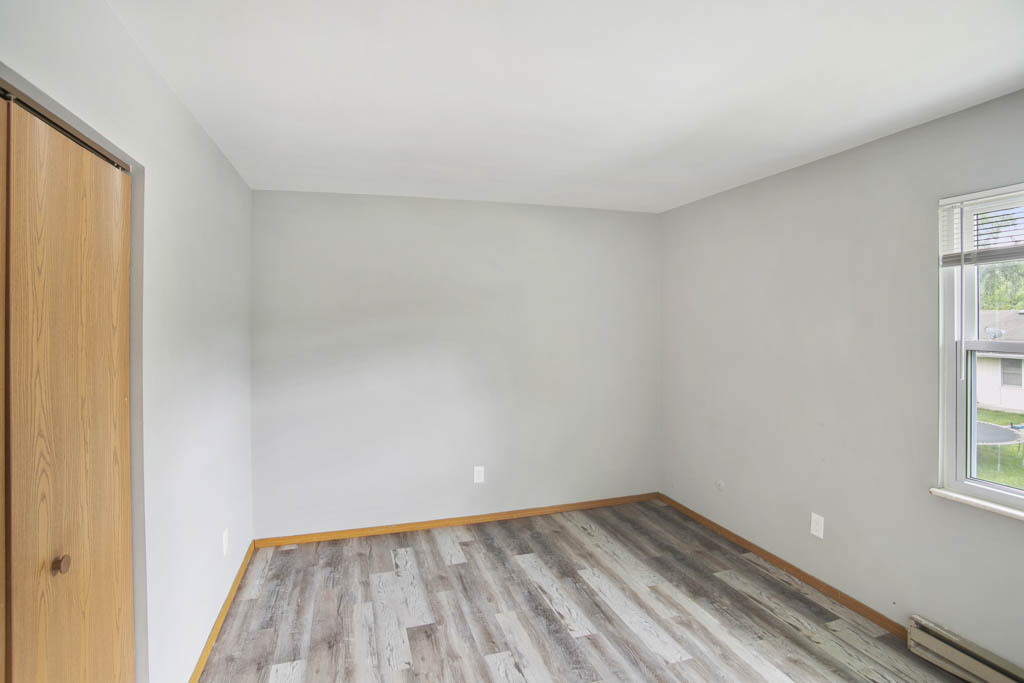 405 East Reed Street, Unit 13 Braidwood, IL 60408 - Photo 7 of 9 a view of wooden floor and windows in a room