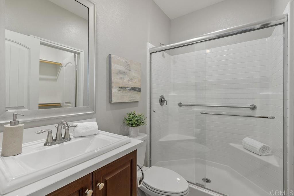 33802 Edge Lane Temecula, CA 92592 - Photo 15 of 31 a bathroom with a sink a toilet and shower
