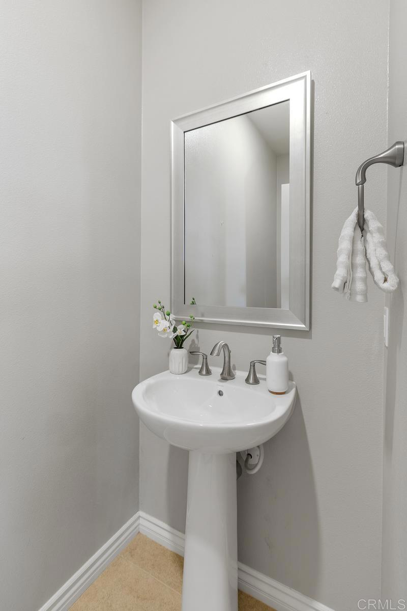33802 Edge Lane Temecula, CA 92592 - Photo 16 of 31 a bathroom with a sink and mirror